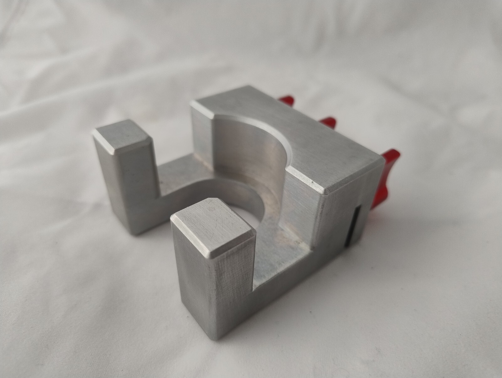 Machined C-stand holder with red clamping handles