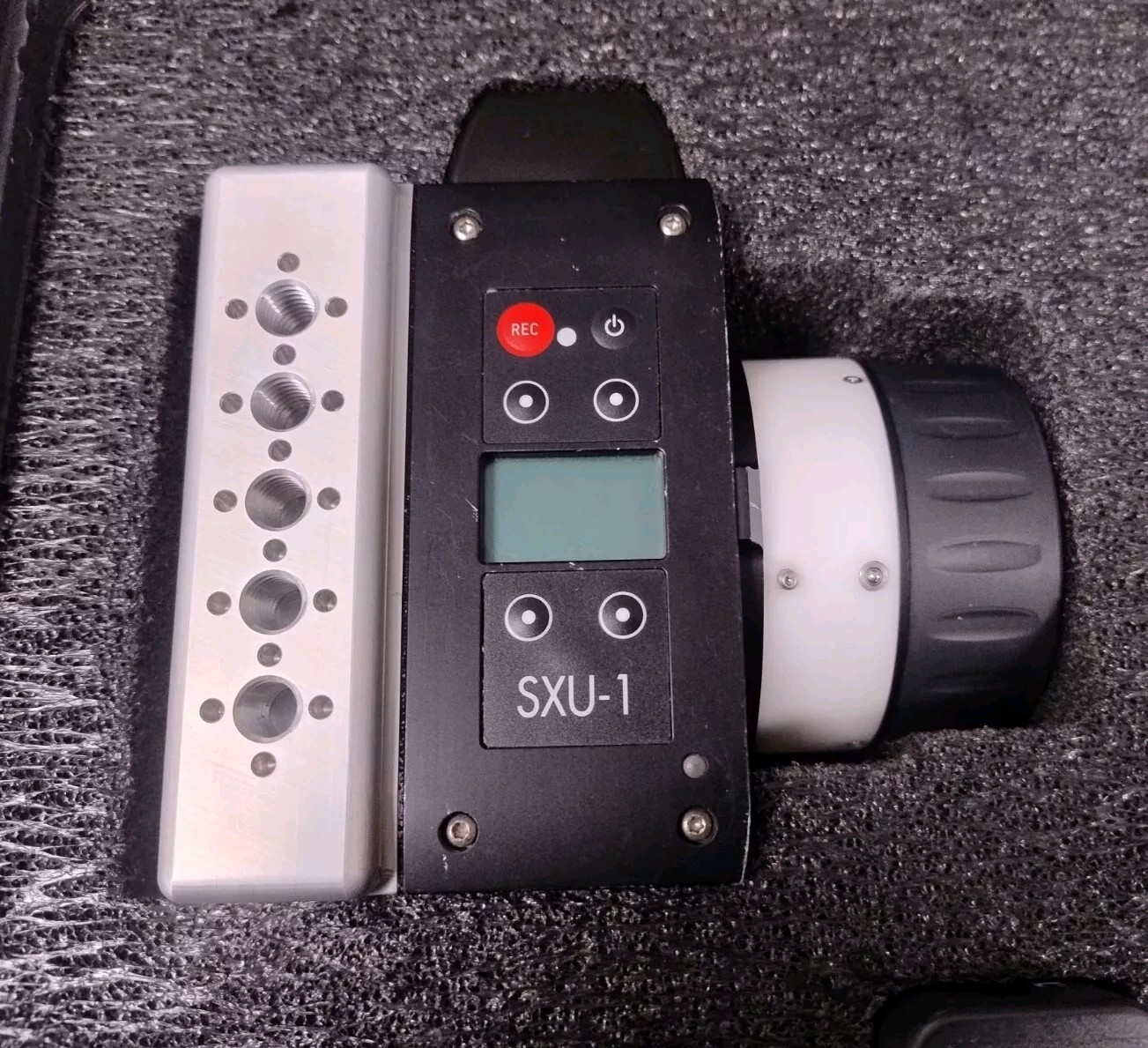Custom metal handle mounted alongside an SXU-1 controller