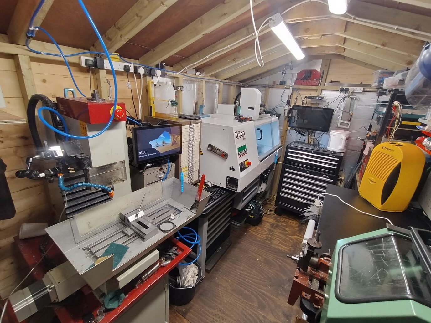 Camera Tech Solutions workshop with machining equipment, workbenches and tool storage